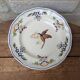 Vintage Longchamp plate handmade with bird and flower decoration, 25.5cm.