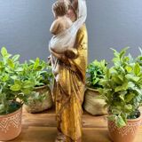 Statue of the Virgin holding the Child Jesus in polychrome terracotta.