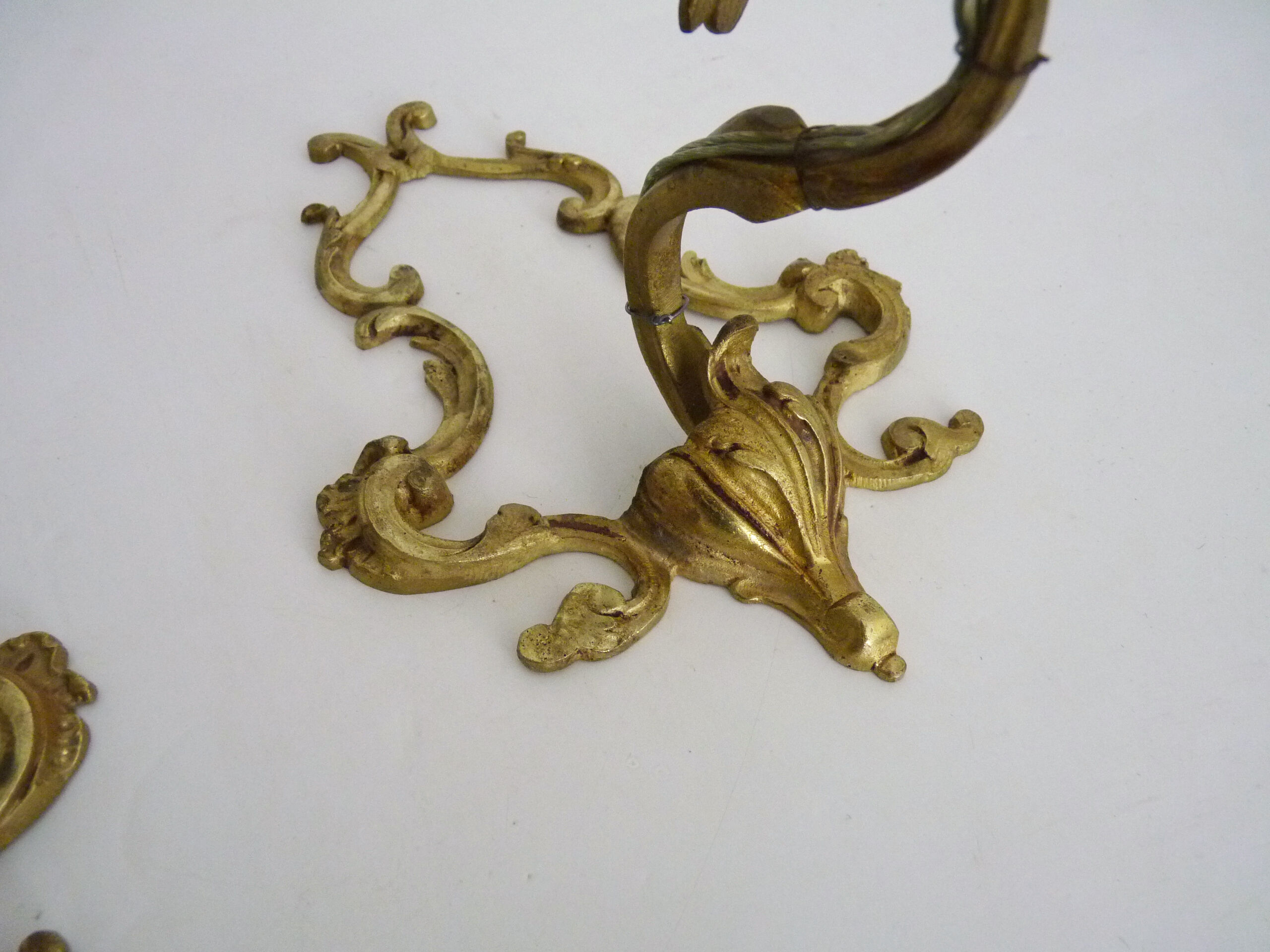 Vintage pair of bronze wall sconces from the 1950s and 60s.