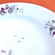 Antique white porcelain shallow dish with floral decoration.