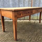 Antique solid cherry farmhouse table with 2 front drawers.