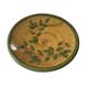 Decorative glazed terracotta plate with olive leaf pattern.