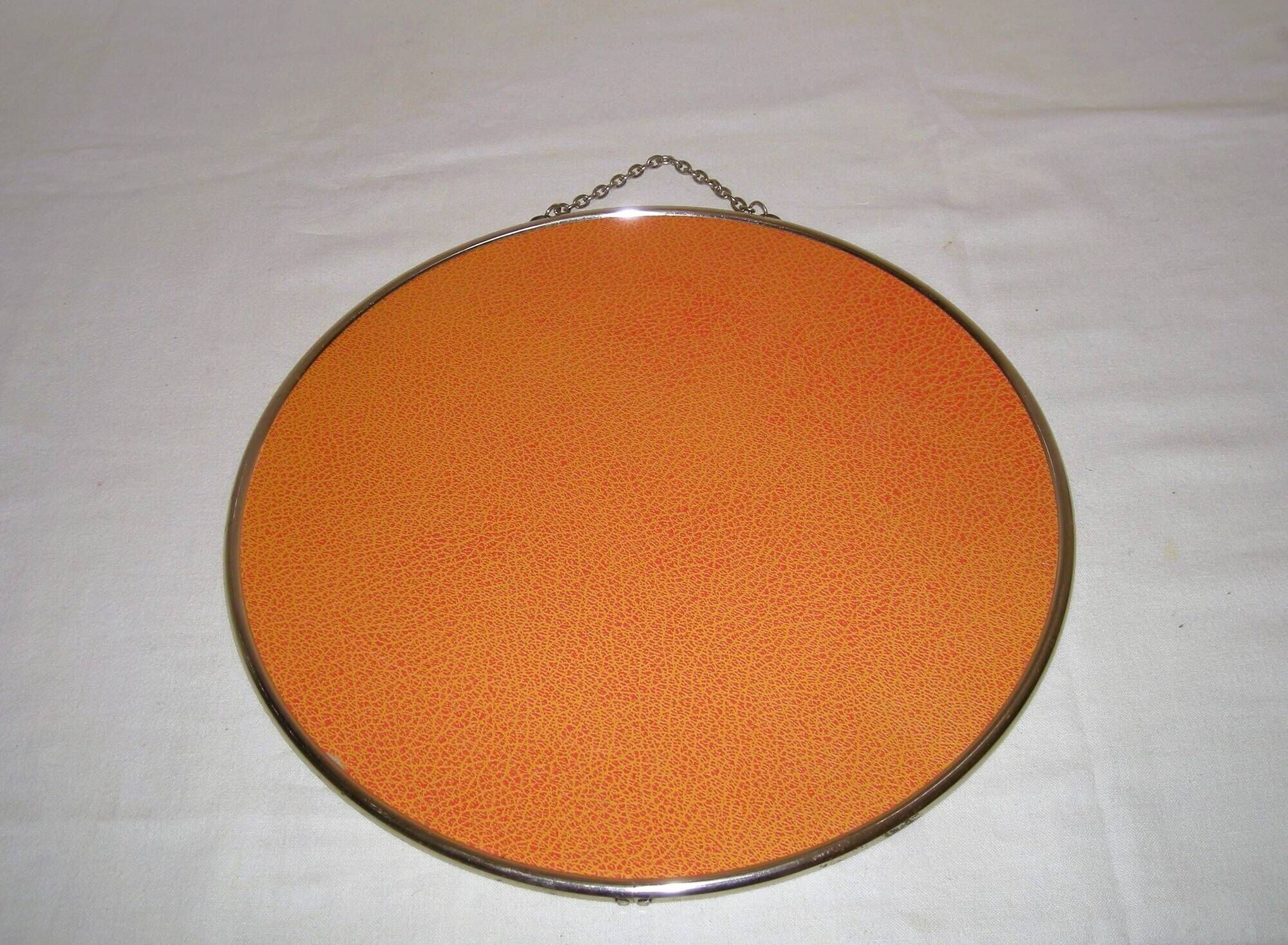 Round barber mirror with chain from the 1950s.