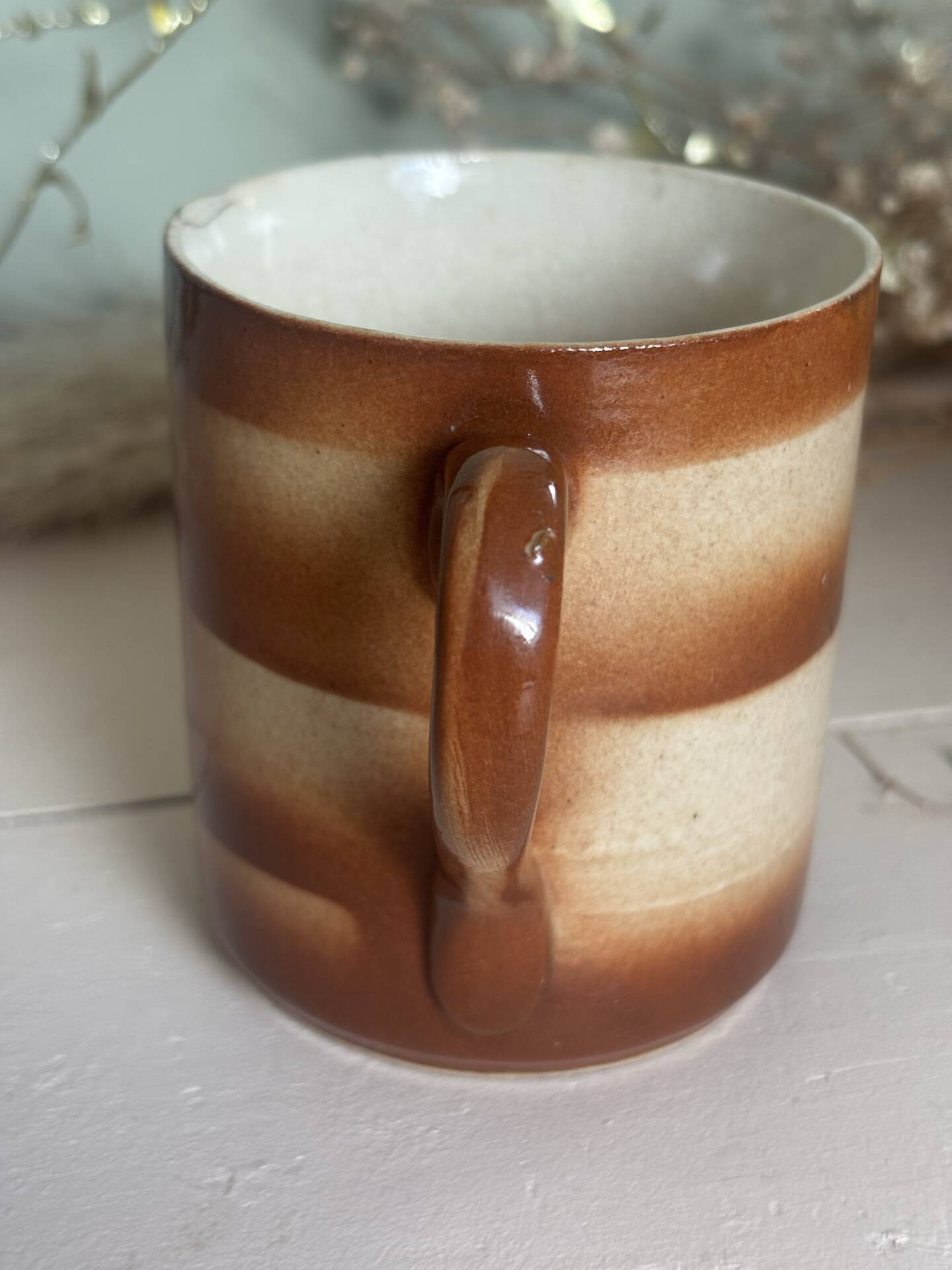 Vintage 70s old ceramic mug with a brown cubic graphic pattern.