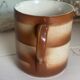 Vintage 70s old ceramic mug with a brown cubic graphic pattern.