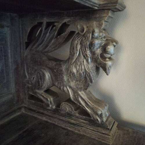 Carved two-body sideboard with 2 lions