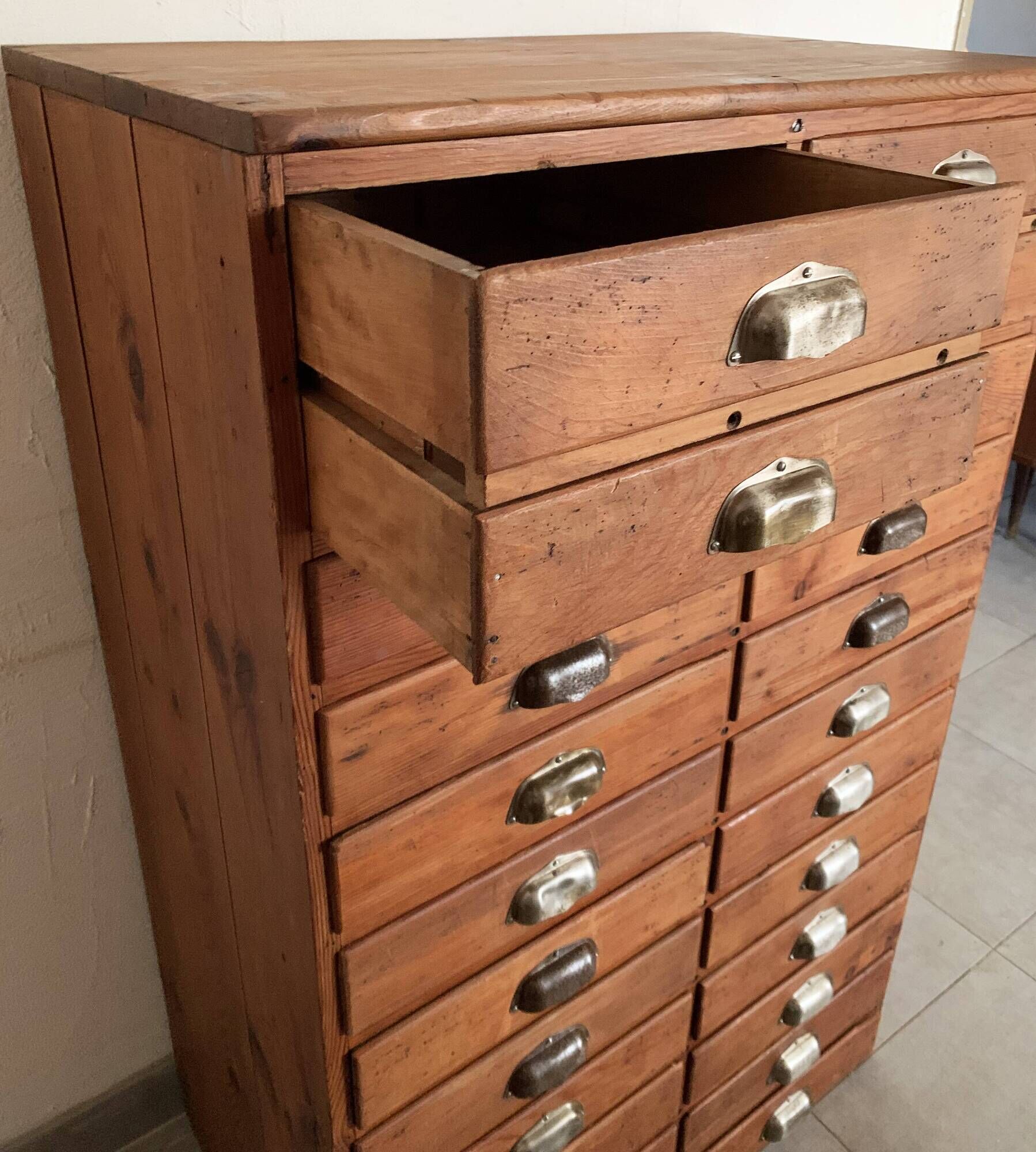 Old apothecary trade furniture in vintage wood 24 drawers.