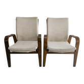 Two vintage 1950s Scandinavian armchairs in oak veneer.