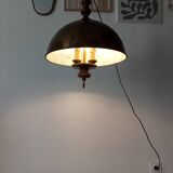 Rustic old wooden and brass suspension.