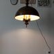 Rustic old wooden and brass suspension.