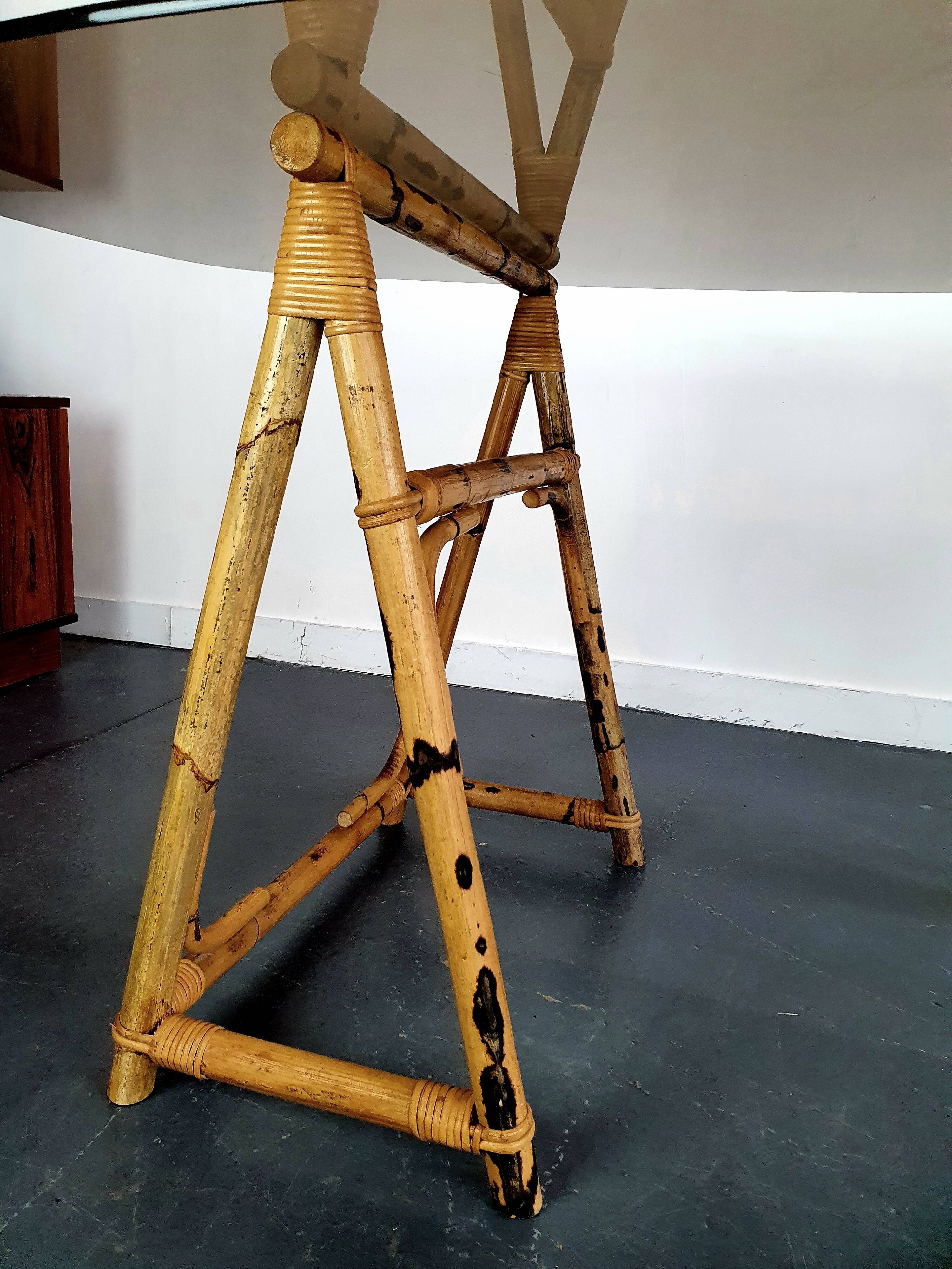 1970s dining table with bamboo trestle legs and smoked glass