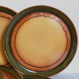 Six vintage stoneware plates with green net