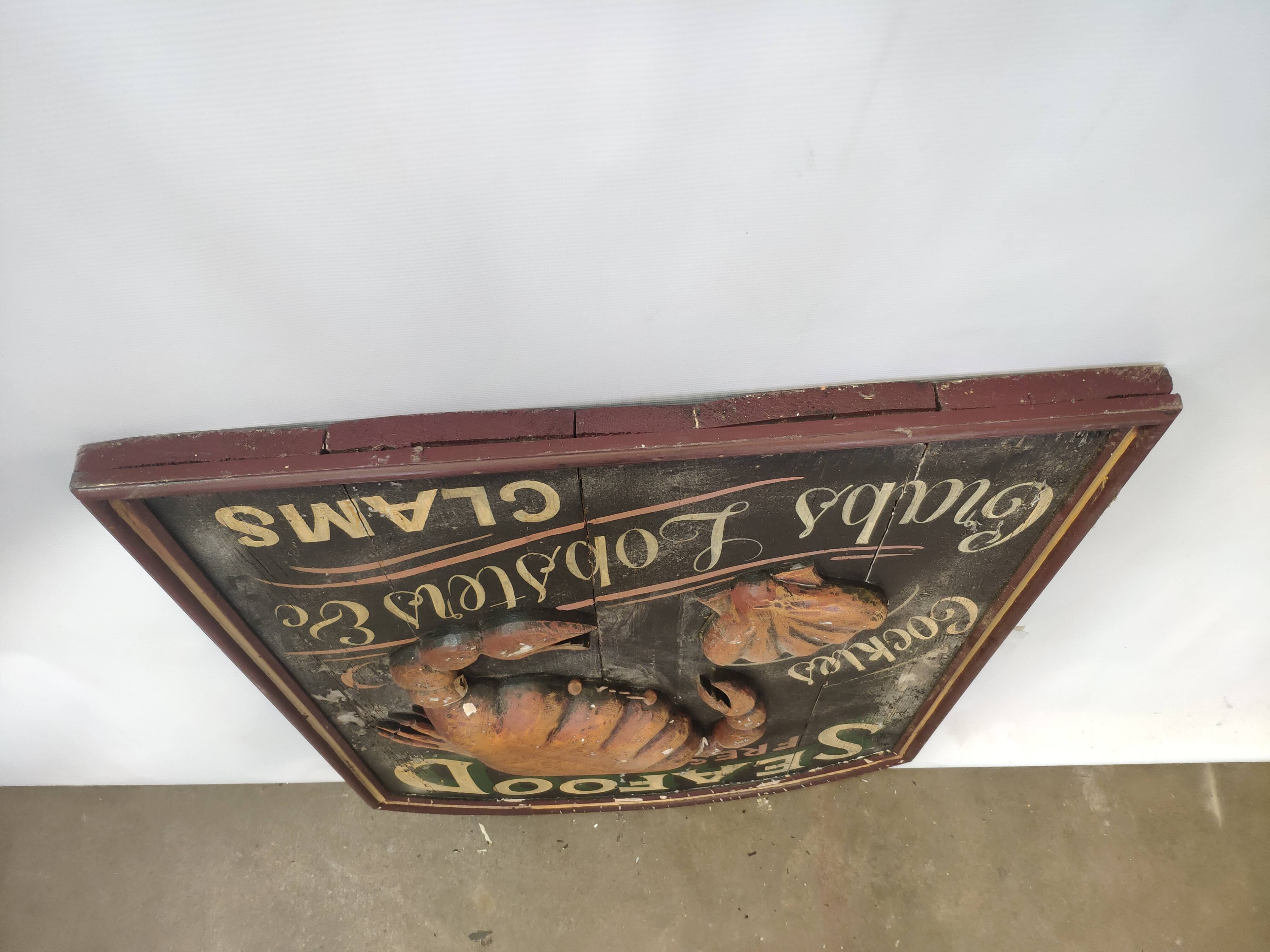 Former Seafood restaurant sign in rare relief