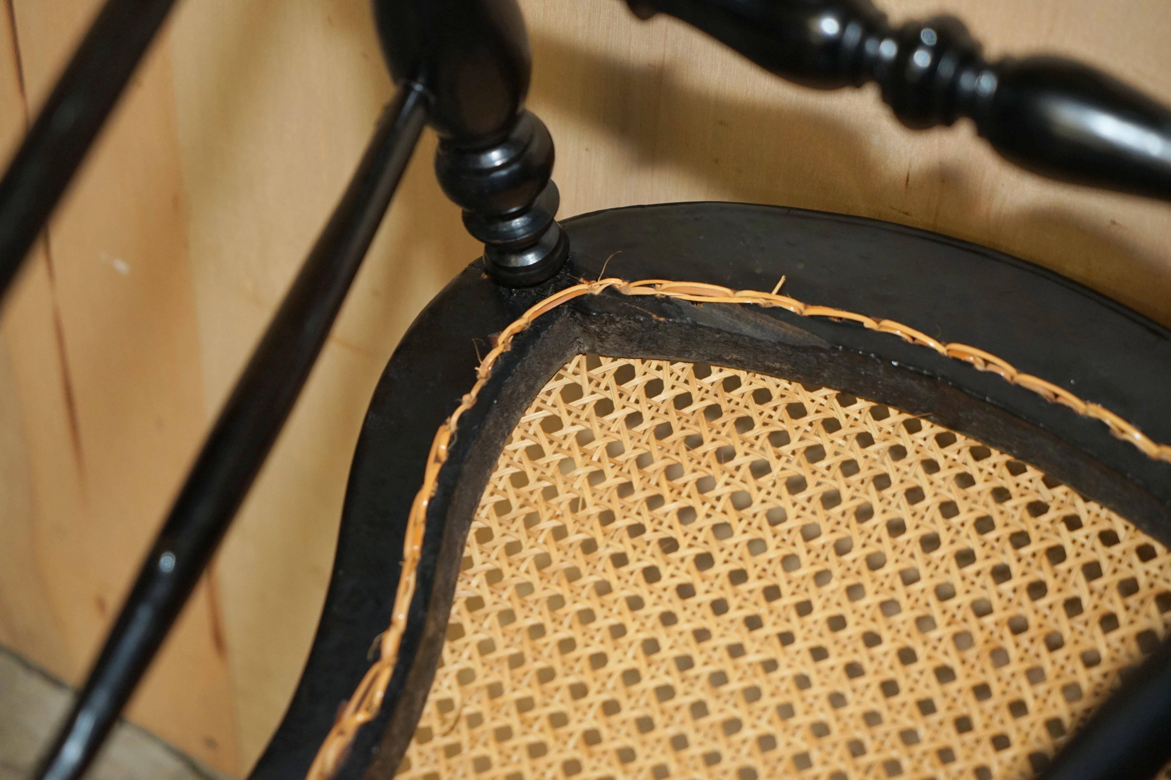 Four antique Regency bergère chairs with mother-of-pearl inlay.