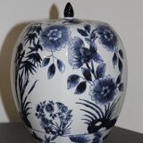 A pair of Chinese blue and white ovoid vases and flush-fitting circular covers