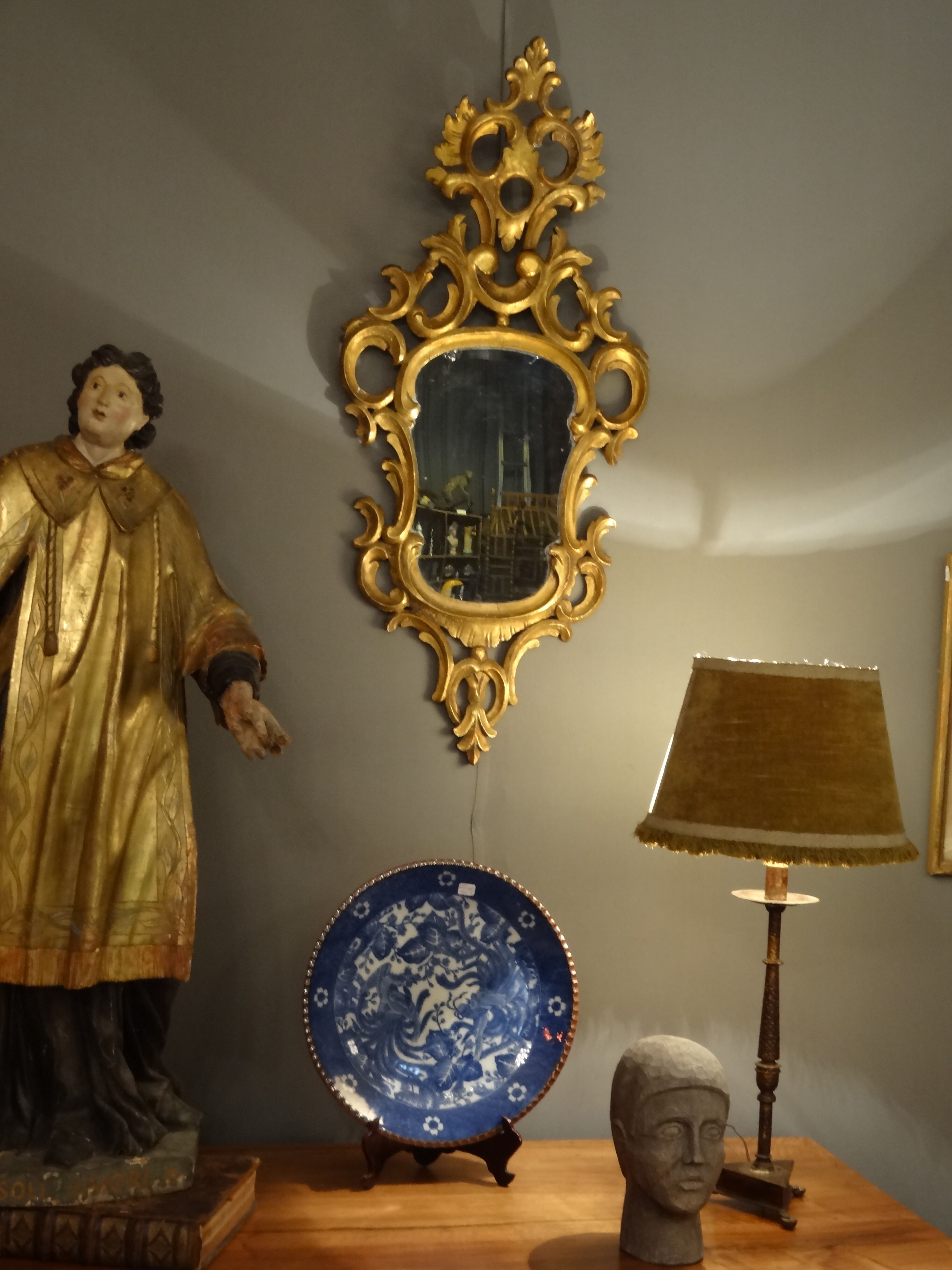 Carved and gilded wooden mirror with gold leaf 46 x 103 cm