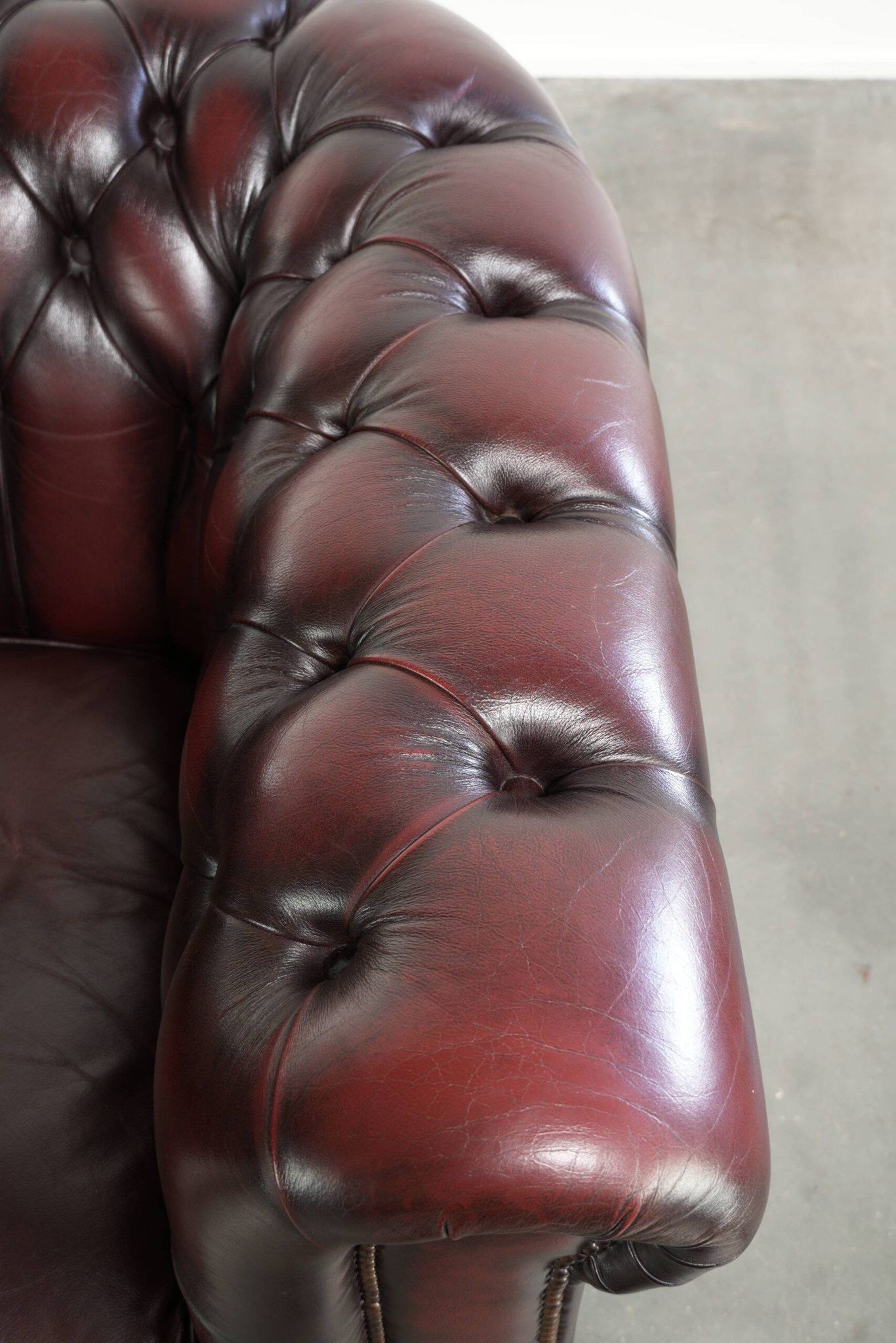 English cowhide Chesterfield club armchair in a beautiful red colour