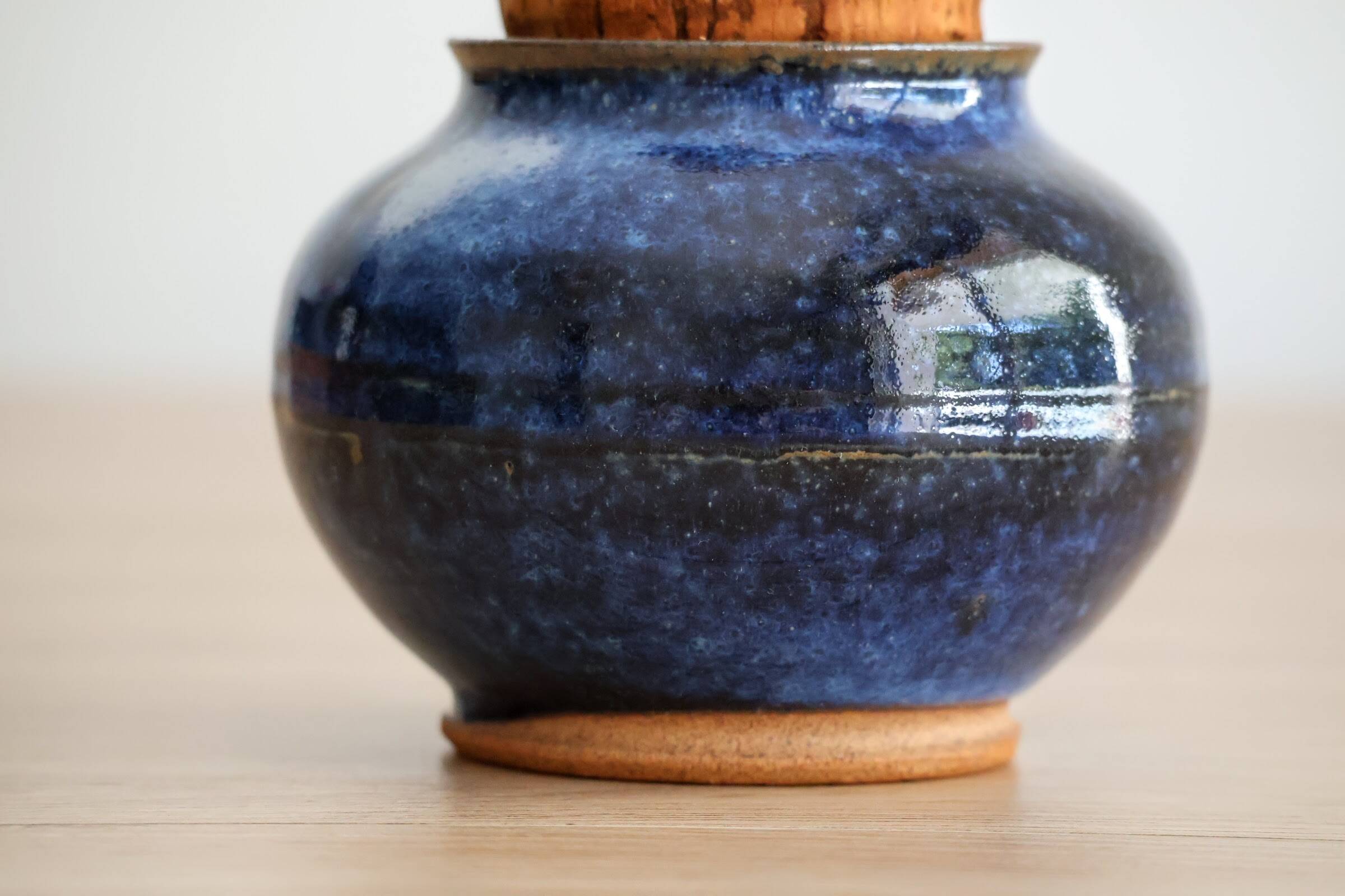 Blue glazed stoneware pot with cork stopper