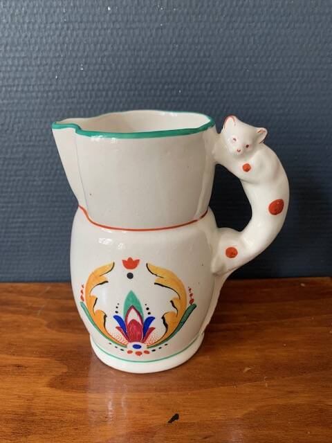 Hand-painted earthenware cream pot with cat handle, 19th century