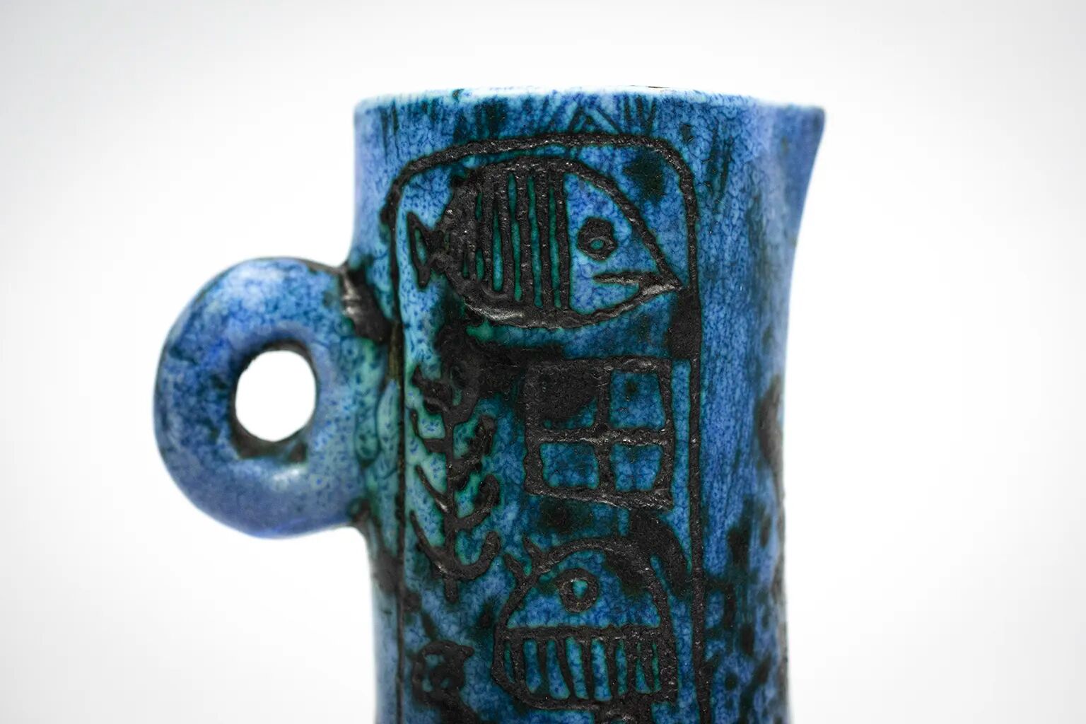 Small jug by Jacques Blin in blue ceramic with engraved animal decoration.