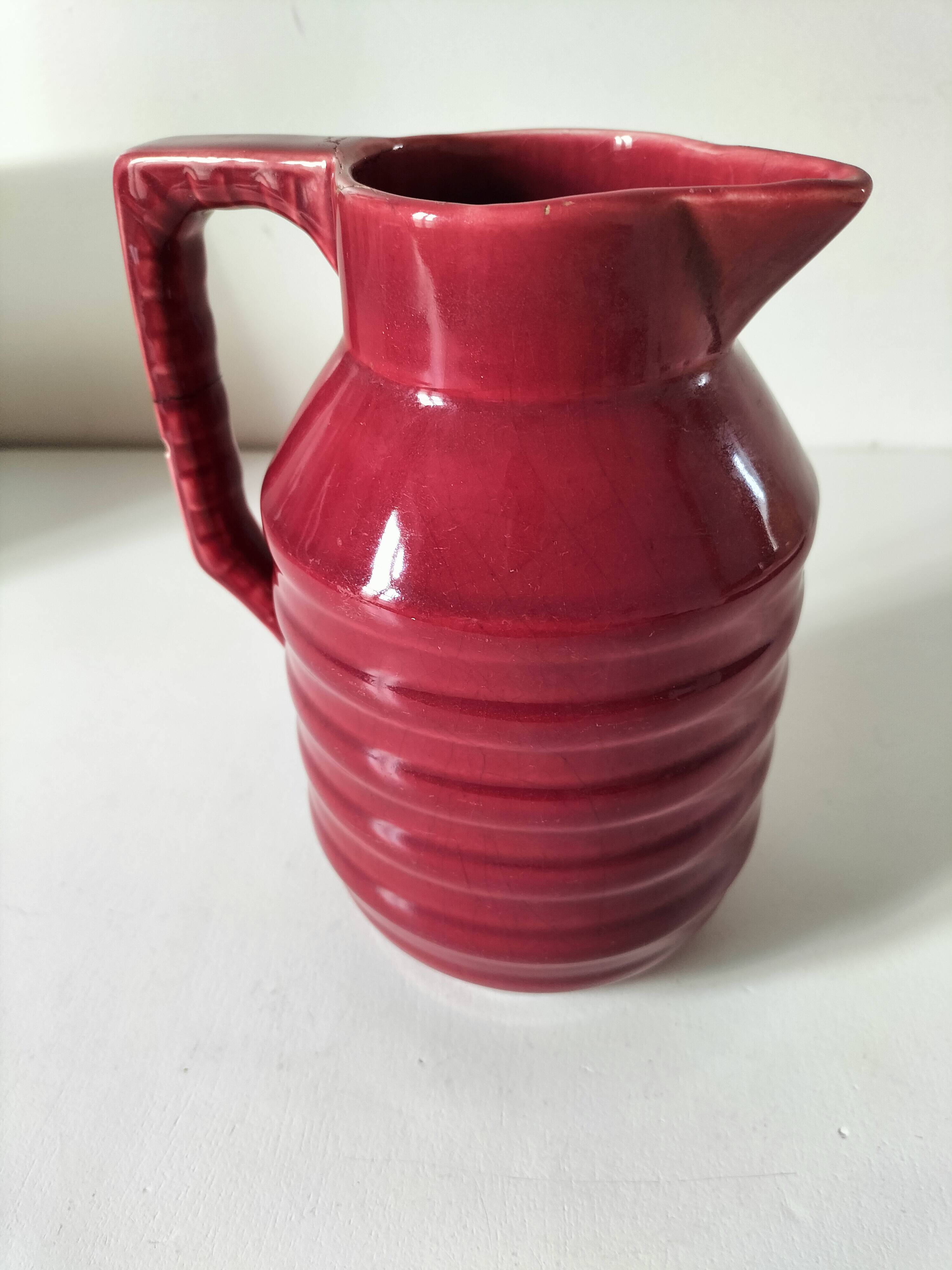 Old raspberry red pitcher from Onnaing, early 20th century.