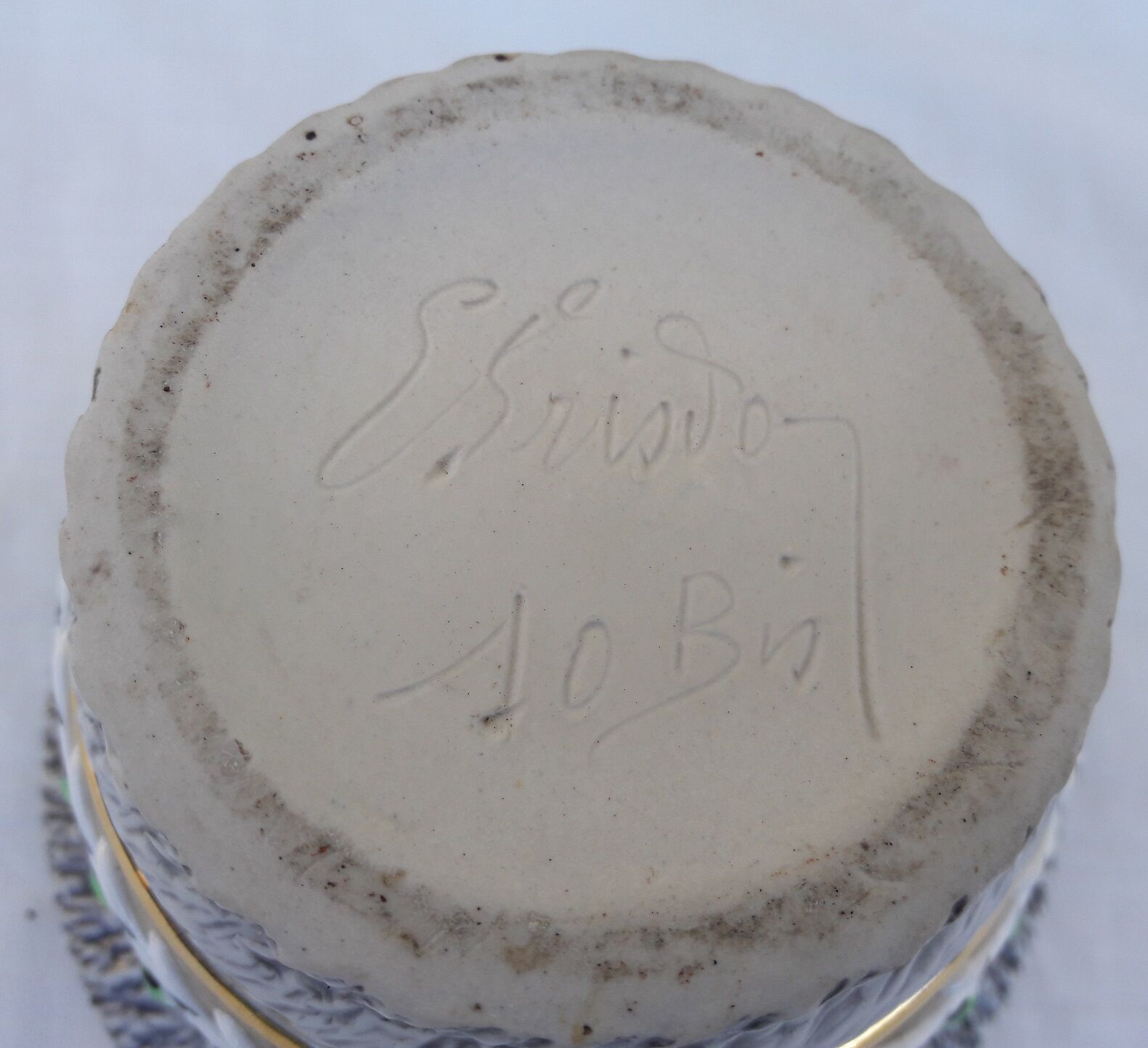 Signed sandstone pot cover