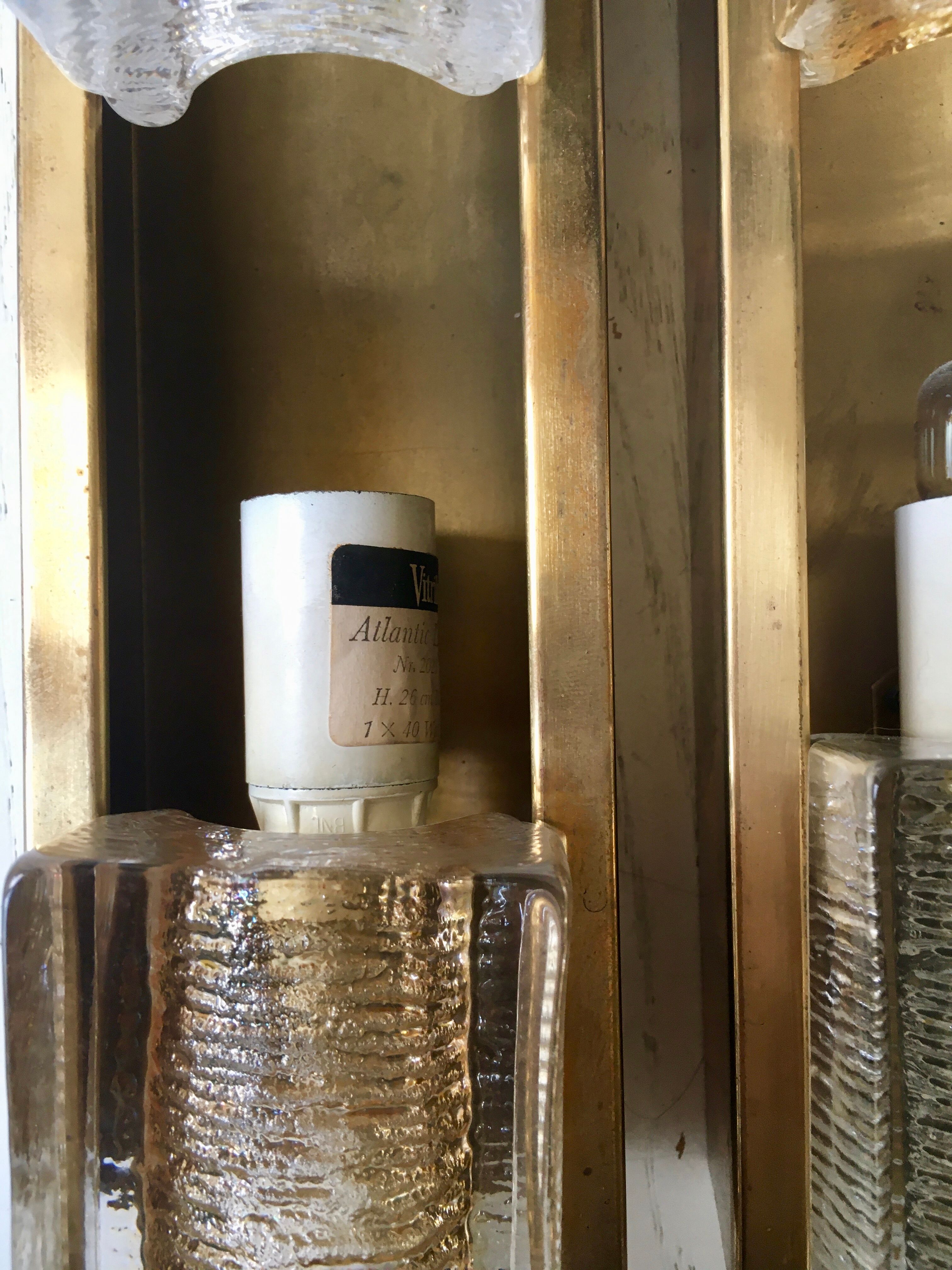 Pair of Vitrika wall lamps in glass and brass