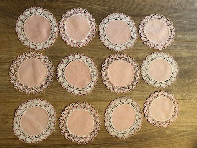 11 pink hand-lace coasters