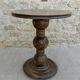 Pedestal table on carved wooden base