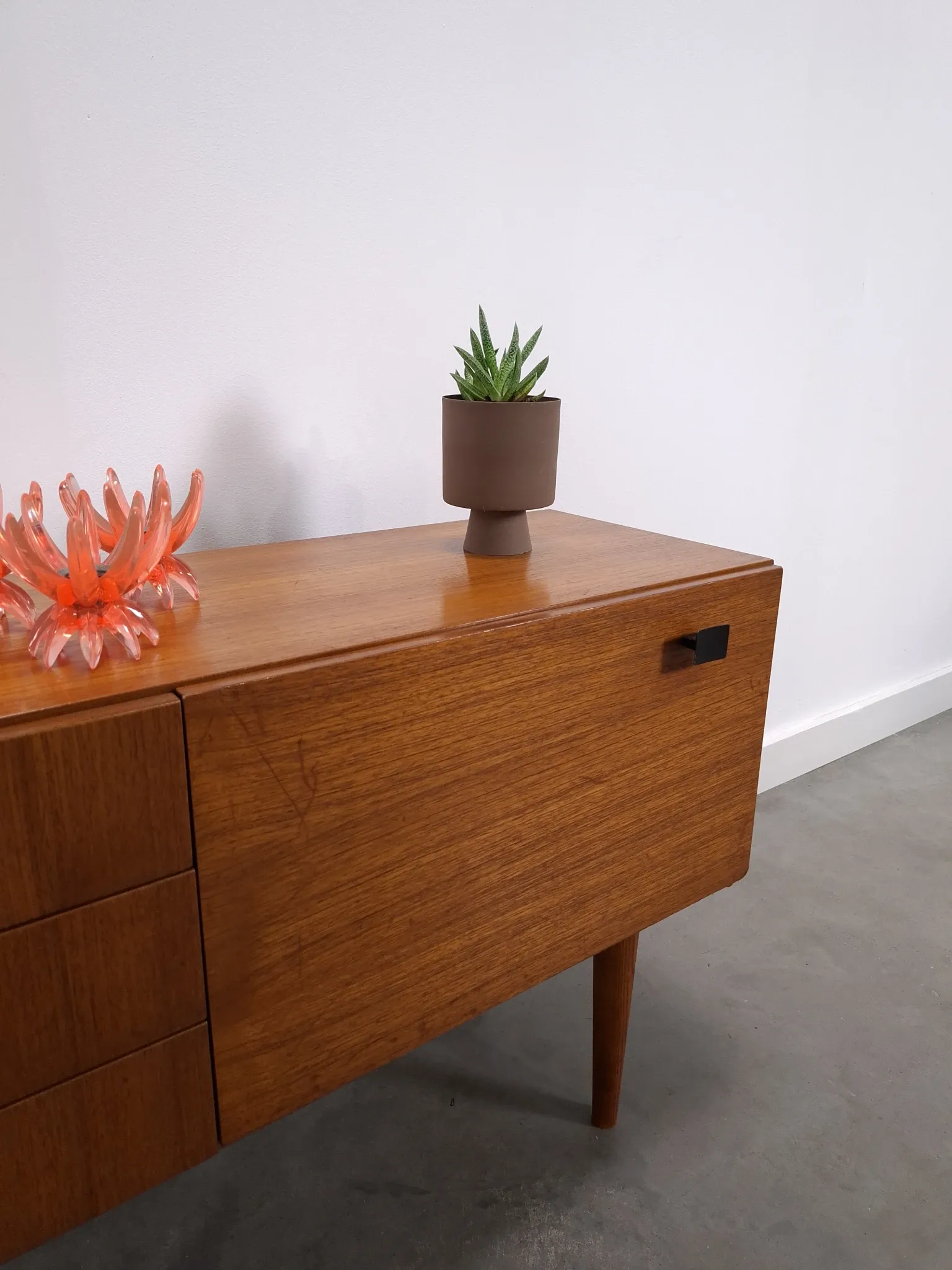 Vintage small teak cabinet with drawers, flap and black handles, hallway cabinet.