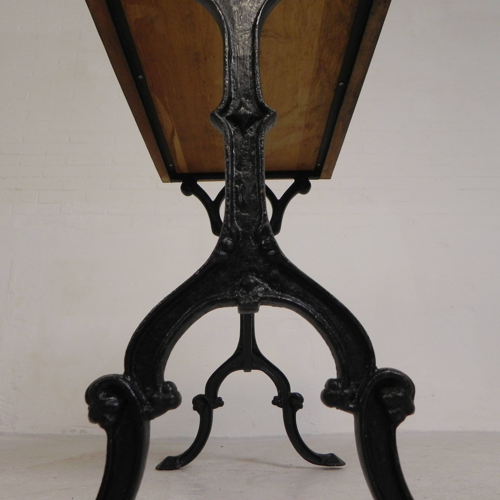 Bistro table with an oak top on a cast iron base, 1930s.