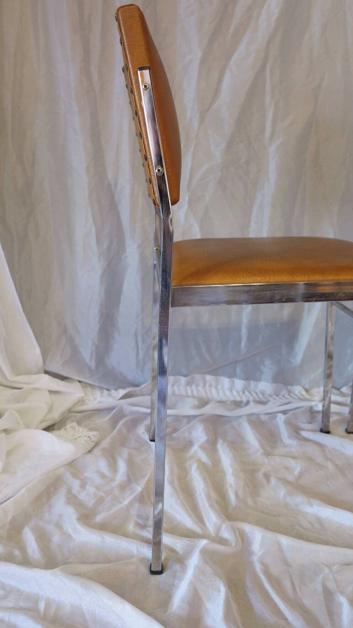 Pair of modernist chairs in chromed metal and imitation leather