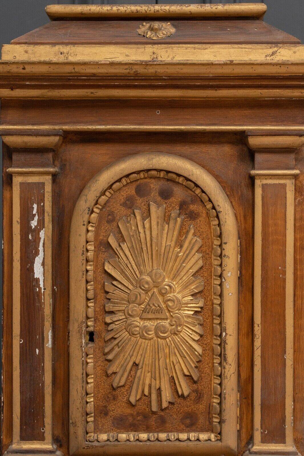 18th century tabernacle decorated with 2 columns and a sun on the facade