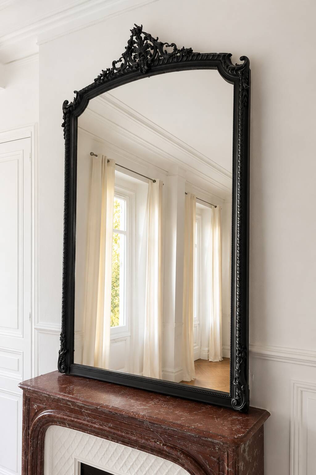 Large antique mirror from the Transition period, with a carved grey frame.