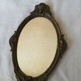 Old hand-facing mirror in gilded bronze