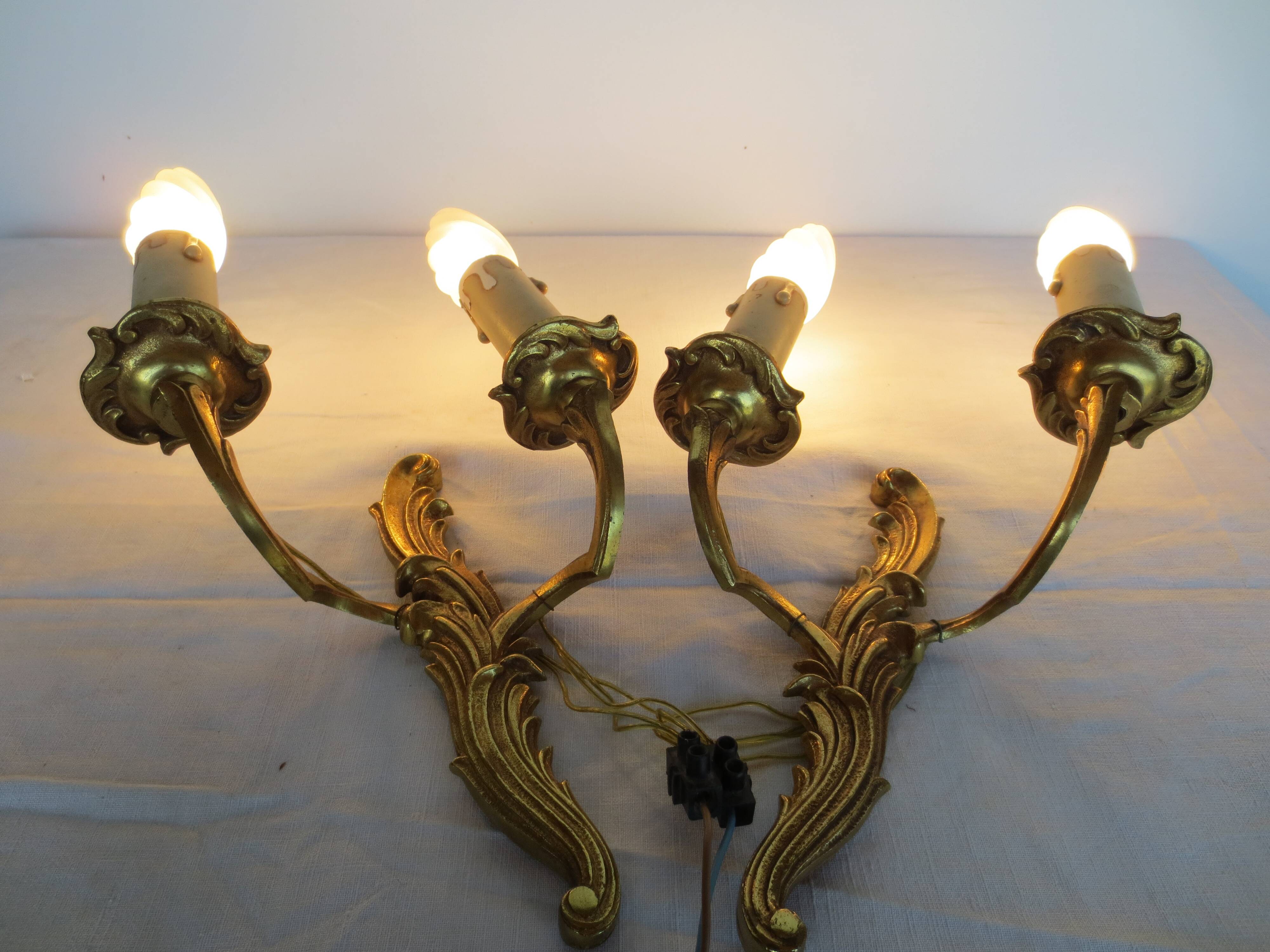 Pair of double wall lights in gilded bronze