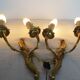 Pair of double wall lights in gilded bronze
