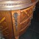 Small curved chest of drawers in Louis XV style with marquetry.