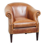 Very comfortable, elegant leather club armchair with a removable seat cushion and timeless design