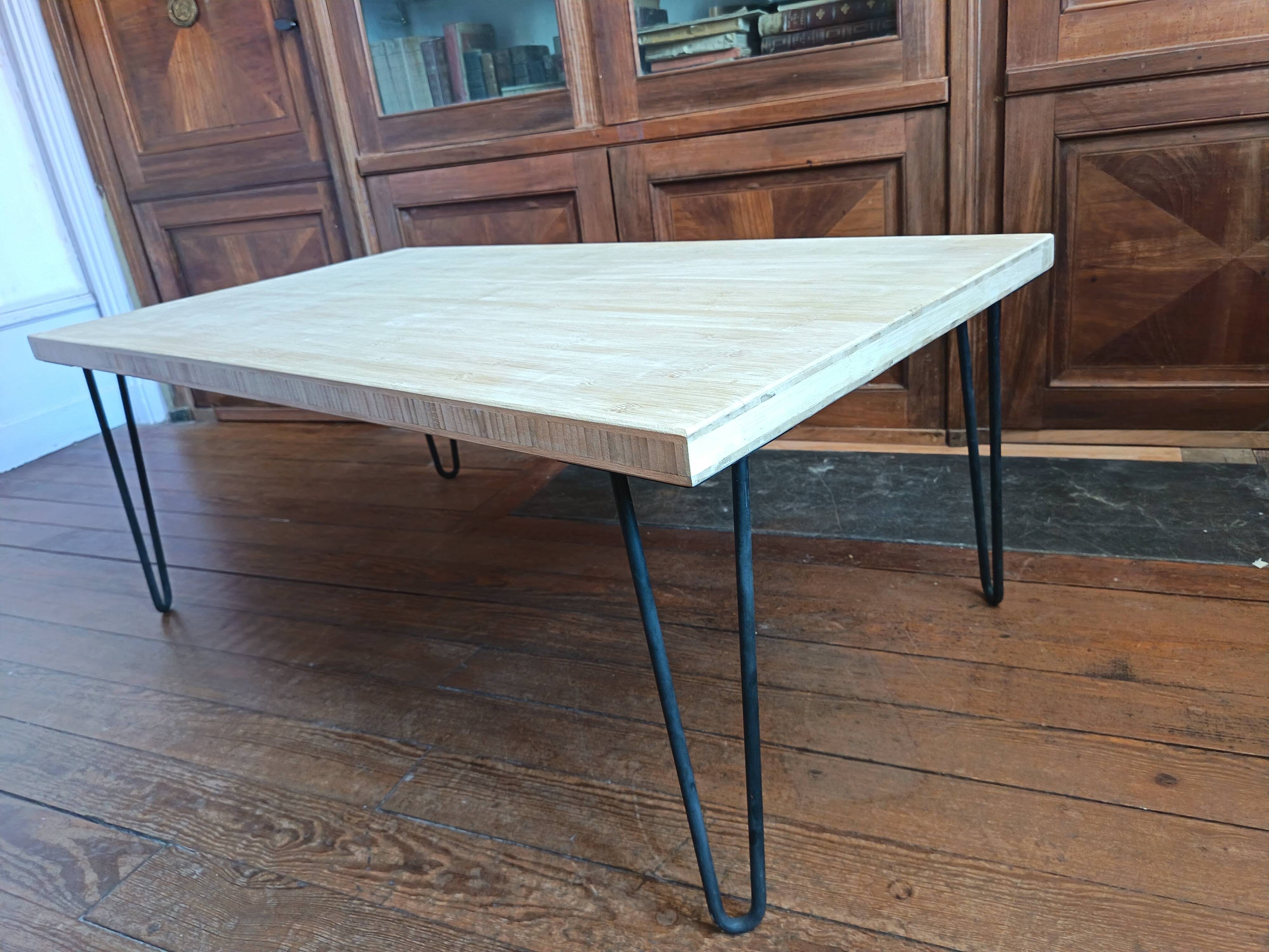 Coffee table in solid bamboo with steel legs.