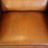 Set of 2 very comfortable large sheepskin armchairs elegantly finished with black piping