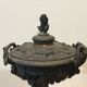 Bronze fireplace garnitures with marble base depicting leaves.