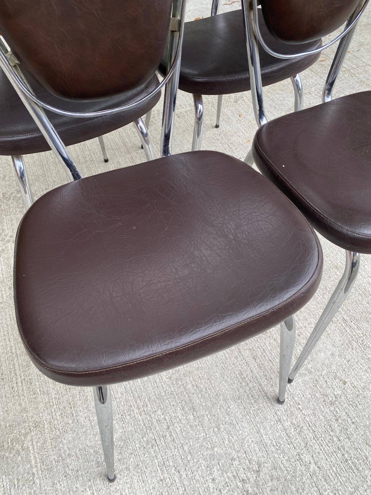Set of 4 vintage chairs from the 60s/70s in brown faux leather with chrome compass legs.