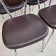 Set of 4 vintage chairs from the 60s/70s in brown faux leather with chrome compass legs.