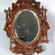 Antique small beveled mirror with carved wooden frame and waxed patina C714