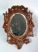 Antique small beveled mirror with carved wooden frame and waxed patina C714