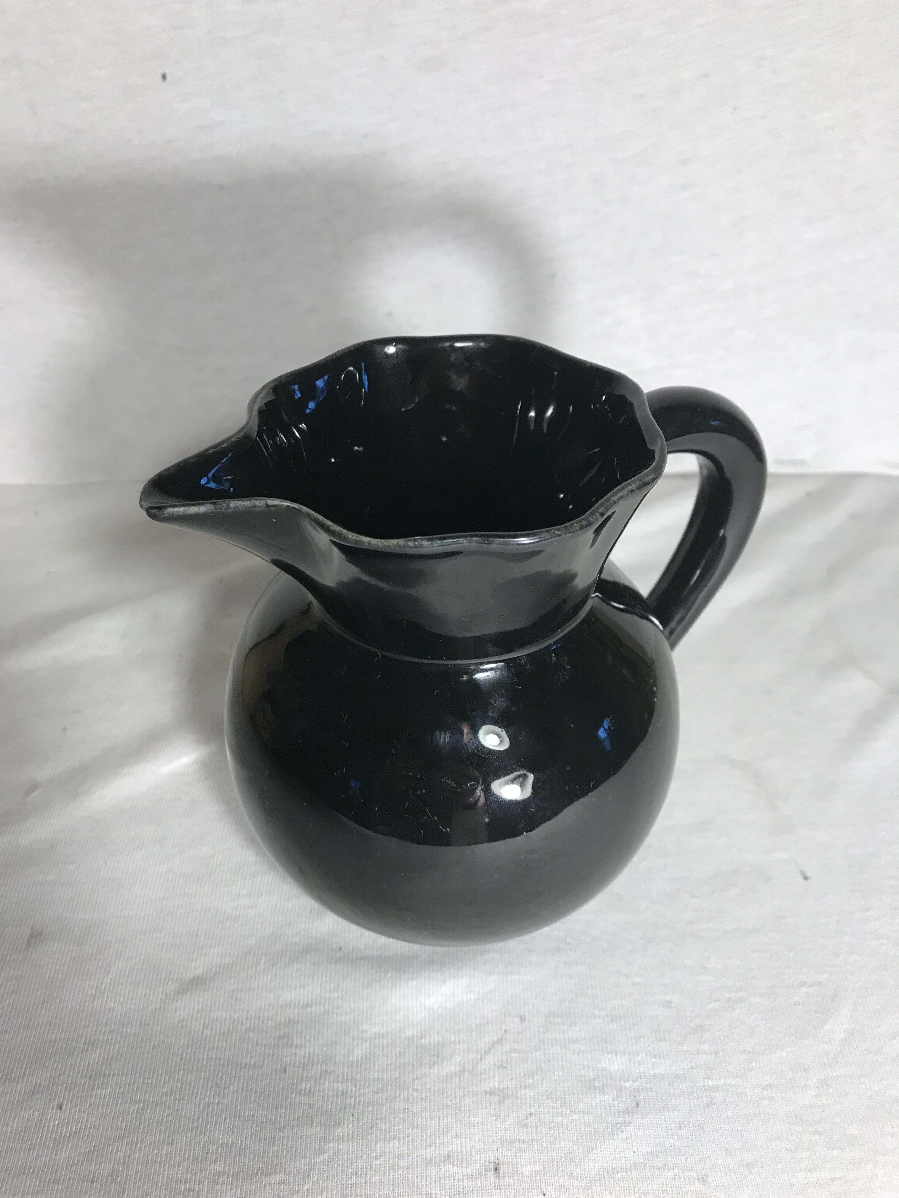 Former enamelled ceramic black pitcher 70s