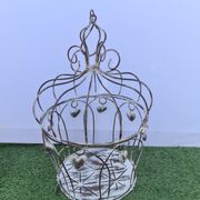 Decorative bird cage with iron hearts