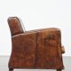Dark brown design armchair made of sheepskin leather