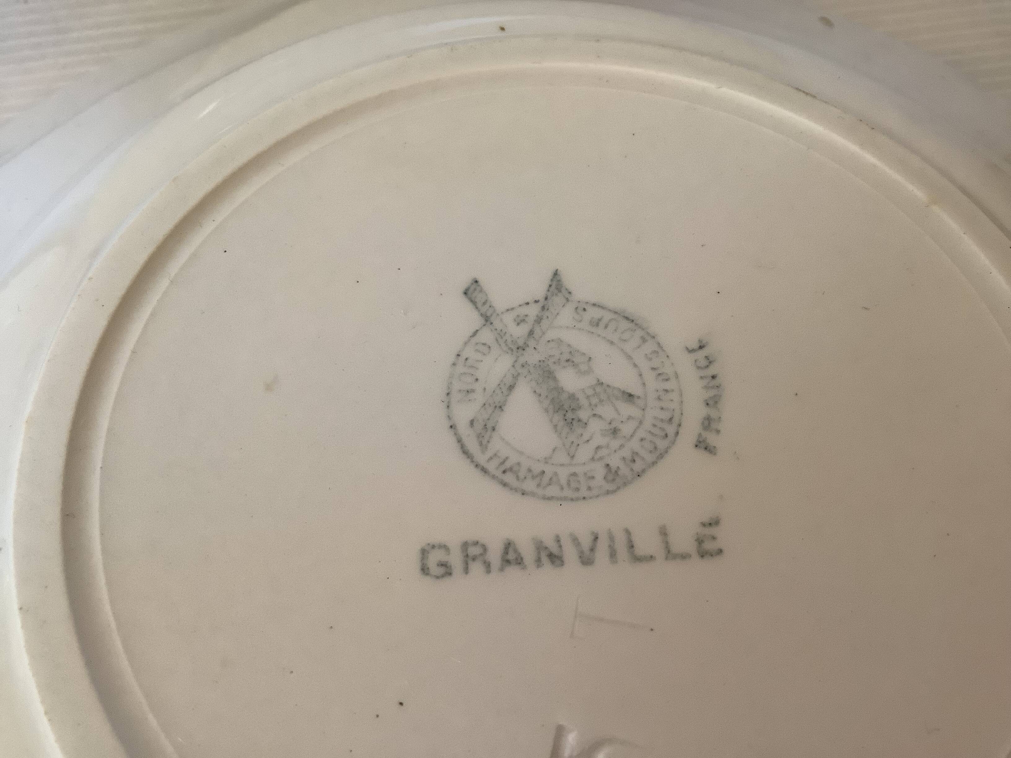 Four old earthenware plates